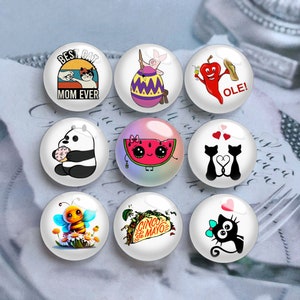 May include: Set of ten 2 inch round glass buttons with various designs. The designs include a cat, a watermelon, a panda, a bee, a taco, a pig, a chili pepper, a cat with hearts, and a cat with a bow.