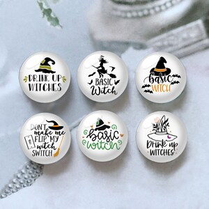 May include: Six circular glass cabochons featuring white backgrounds with black, orange, and green graphic designs. The text includes phrases like Drink Up Witches, Basic Witch, and Don't Make Me Flip My Witch Switch, accompanied by illustrations of witch hats, brooms, and bats.