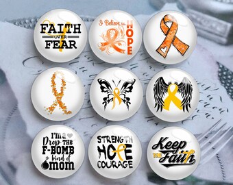 May include: Nine round white buttons with orange and black designs. The buttons feature inspirational messages such as "Faith Over Fear", "I Believe in Hope", "Strength Hope Courage", and "Keep the Faith".