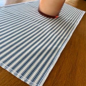 10” x24” runner mat. Use on table or dresser . Nightstand. Blue and cream. White edged . Kitchen decor. Bedroom. Bench or table . New gift