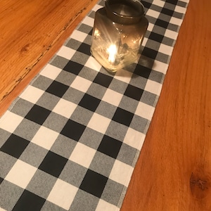 10” x 42” table runner. Black White check. Bedroom dresser. Bench. Couch topper. Home decorating. Hang. Counter top. Bathroom. Kitchen.