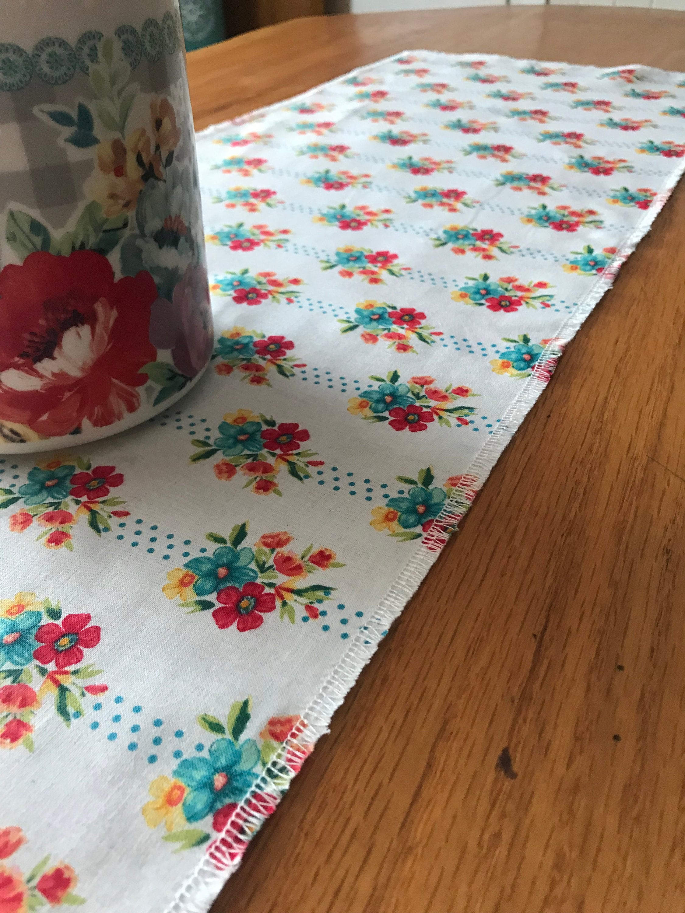 Pioneer woman runner 12” x 42” made with pioneer woman material. Turquoise yellow reds, beautiful runner gift for mom grandma . Dining table