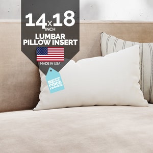 May include: A white lumbar pillow insert with a 14x18 inch size. The pillow is on a beige couch with a striped pillow behind it. The image also includes a tag that says "Best Price Promise" and a small American flag with the text "Made in USA".