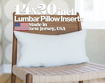 May include: A white lumbar pillow insert on a wooden chair. The pillow is 14x20 inches and made in New Jersey, USA. The text "14x20 inch Lumbar Pillow Inserts Made in New Jersey, USA" is displayed above the pillow.