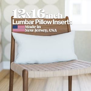 May include: A white lumbar pillow insert on a wooden chair. The pillow is 12x16 inches and made in New Jersey, USA.