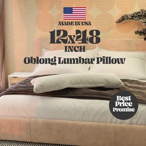 May include: A white oblong lumbar pillow on a bed with a brown throw blanket. The pillow is 12x18 inches. The text "Made in USA" and "Best Price Promise" are also visible.