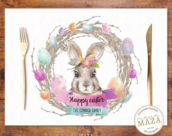 May include: A white Easter placemat with a watercolor wreath of twigs, pastel colored eggs, and a bunny with a flower crown. The text "Happy Easter" and "The Espinosa Family" is printed on the placemat.