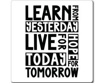 May include: White square sticker with black text. The text reads "LEARN FROM YESTERDAY, LIVE FOR TODAY, HOPE FOR TOMORROW". The words are stacked in a block format with the words "FROM", "FOR", and "HOPE" on the right side.
