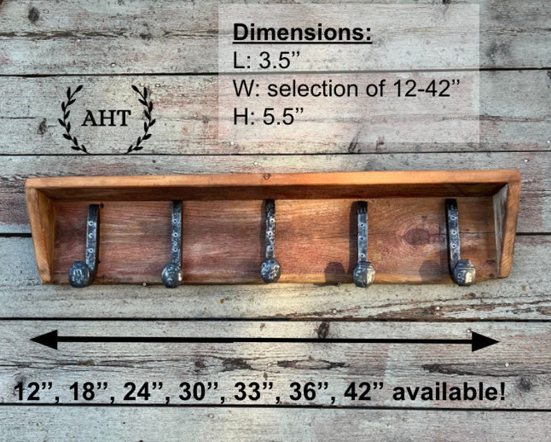 May include: A wooden shelf with five metal hooks, measuring 3.5 inches in length, 5.5 inches in height, and available in widths from 12 to 42 inches. The shelf is made of reclaimed wood and has a rustic finish. The hooks are made of black metal and have a hammered finish. The shelf is perfect for hanging coats, hats, keys, or other items.