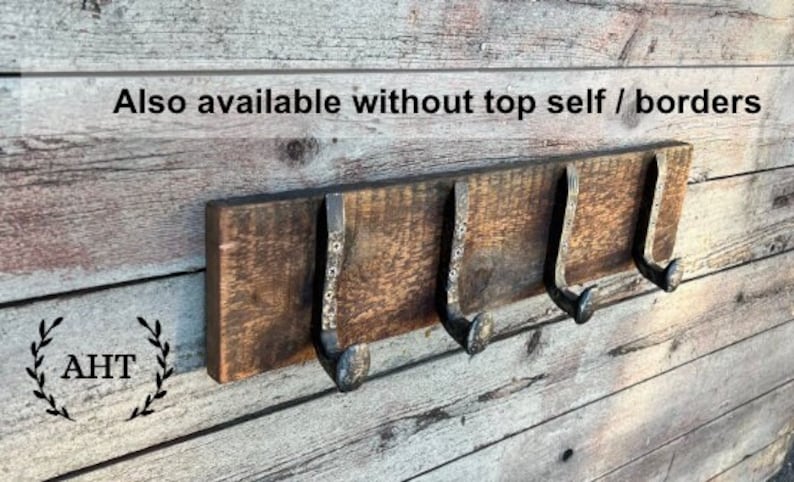 May include: A rustic wooden coat rack with three metal hooks. The rack is mounted on a wooden wall. The text "Also available without top self / borders" is visible above the rack.