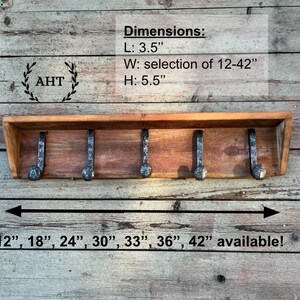 Puede incluir: Un perchero de pared de madera con cinco ganchos de metal oscuro. El estante incluye el texto: Dimensions: L: 3.5", W: selection of 12-42", H: 5.5". Debajo, el texto indica: 12", 18", 24", 30", 33", 36", 42" available!