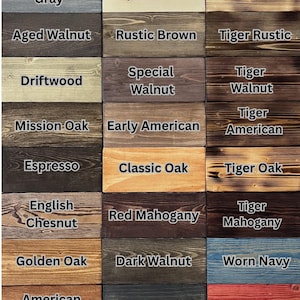 May include: A grid of thirty rectangular wood samples displaying various stain colors and finishes. Each sample is labeled with text including Classic Gray, Antique White, Tiger White, Weathered Gray, Natural, Tiger Natural, Aged Walnut, Rustic Brown, Tiger Rustic, Driftwood, Special Walnut, Tiger Walnut, Mission Oak, Early American, Tiger American, Espresso, Classic Oak, Tiger Oak, English Chesnut, Red Mahogany, Tiger Mahogany, Golden Oak, Dark Walnut, Worn Navy, American Chesnut, Ebony, Barn Red, Antique Walnut, Black, and + Custom Options!