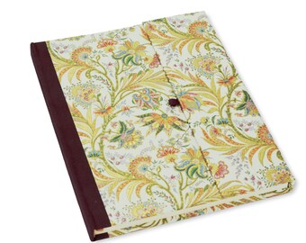 Diary "Motiv Cipro", notebook 5,8 x 8,3 ”(A5) unlined, hardcover magnetic clasp, gold embossing, white with golden flower tendrils, 240 Sh.