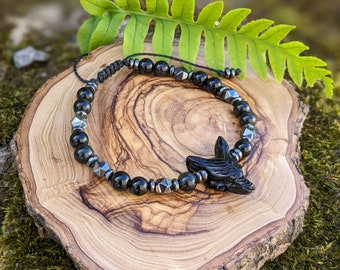 Pulsera de obsidiana y hematita con tótem de lobo