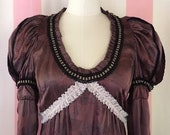 Silk glittered long sleeved boho dress adorned with butterfly appliqués and Elizabethan shoulder rolls