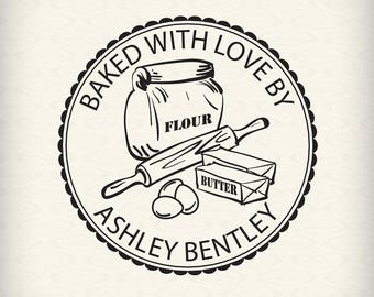 May include: Black and white illustration of a baking stamp with the text "Baked with Love By Ashley Bentley". The stamp features a bag of flour, a rolling pin, a stick of butter, and three eggs.