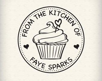 May include: Black and white illustration of a cupcake with a heart-shaped topper. The cupcake is inside a circle with the text "From the Kitchen of Faye Sparks".