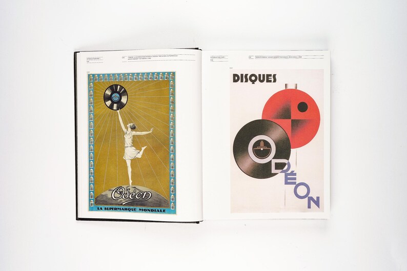 May include: Two-page spread from a book featuring vintage advertisements. One page shows a woman holding a record above her head, with the text "Odeon" and "LA SUPERMARQUE MONDIALE". The other page displays the word "DISQUES" and a graphic of records.
