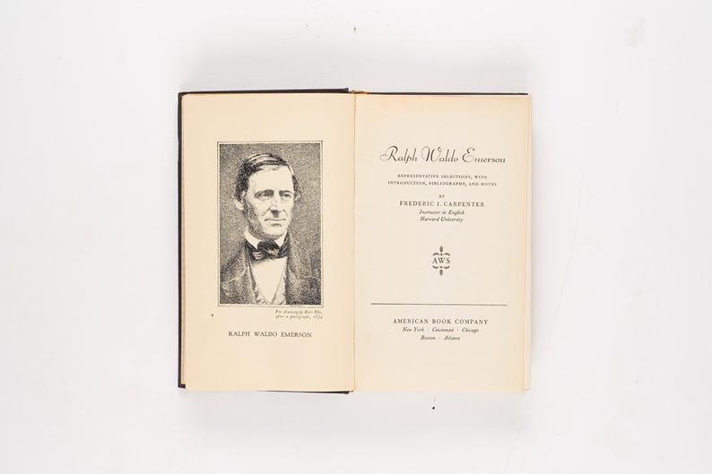 May include: An open book featuring a portrait of Ralph Waldo Emerson on the left page and the title page of a book on the right. The title page reads "Ralph Waldo Emerson" and includes the author's name, Frederic I. Carpenter, and the American Book Company logo.