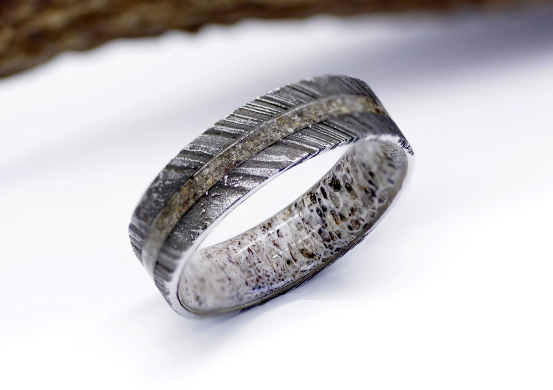 Dinosaur fossil ring Damascus wedding band lined with