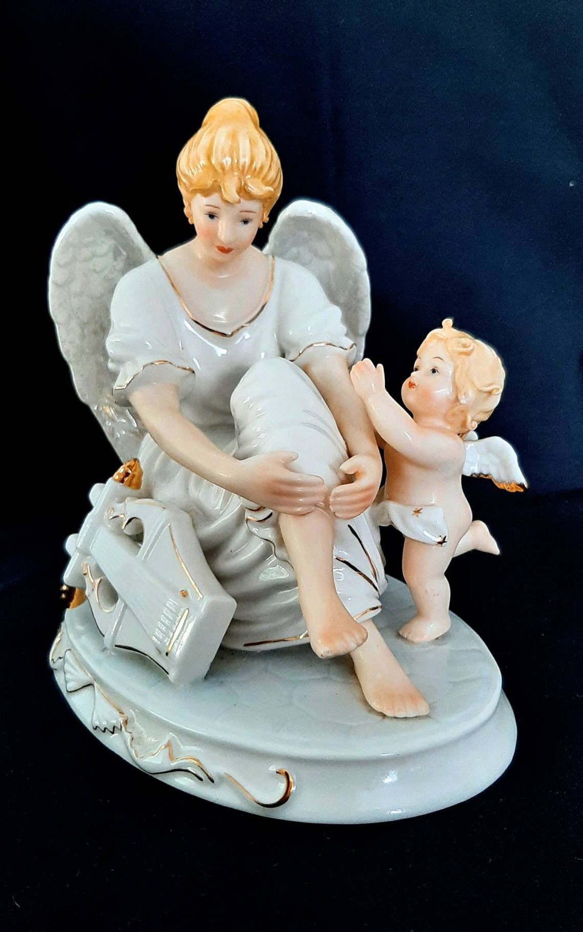 O'Well white fine porcelain Angel figurine with baby Etsy