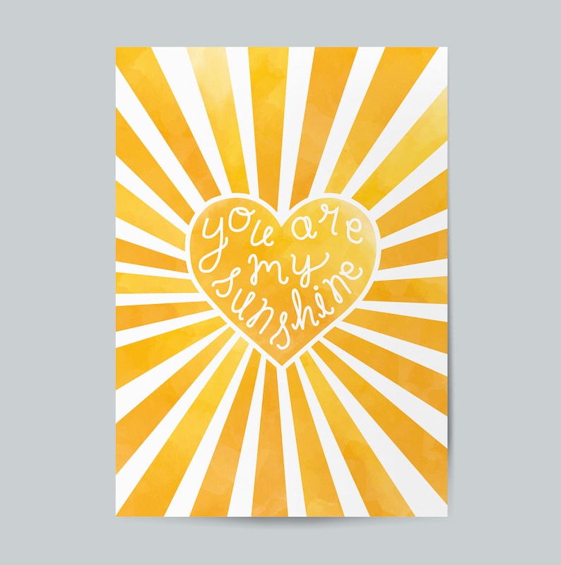 May include: A yellow watercolor sunburst with a white heart in the center. The heart has the text "You are my sunshine" written inside.