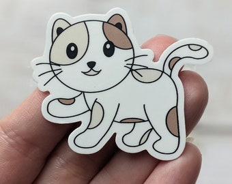 May include: A white and brown cartoon cat sticker with black eyes and a brown nose. The cat is walking with its tail curled up.