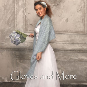 May include: A woman wearing a white dress and a light blue shawl holds a bouquet of blue flowers. The text "Gloves and More" is visible at the bottom of the image.