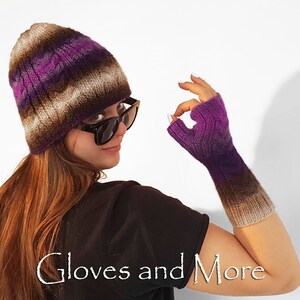May include: A woman wearing a purple and brown striped knitted hat and matching fingerless gloves. The gloves have a gradient pattern of purple and brown.