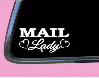 May include: White vinyl decal with the text "MAIL Lady" in a bold font with two hearts on either side of the word "Lady".