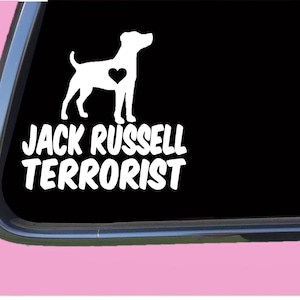 May include: White vinyl decal of a Jack Russell Terrier with a heart on its chest. The text "JACK RUSSELL TERRORIST" is below the dog.
