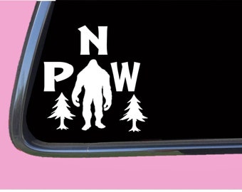 May include: White vinyl decal with the words "N.P.A.W." and a silhouette of Bigfoot standing between the words "P" and "A". Two pine trees are on either side of Bigfoot.