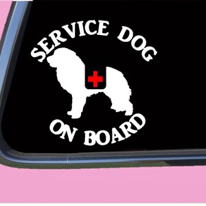 May include: White silhouette of a dog with a red cross on its back, with the text "SERVICE DOG ON BOARD" in a white circle around the dog.