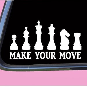 May include: White vinyl decal of a chess set with the text "MAKE YOUR MOVE" below. The chess pieces are arranged in order of rank from pawn to king.
