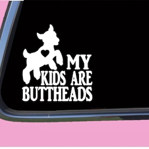May include: White vinyl decal with a silhouette of a goat with a heart on its side. The text "My Kids Are Buttheads" is below the goat.