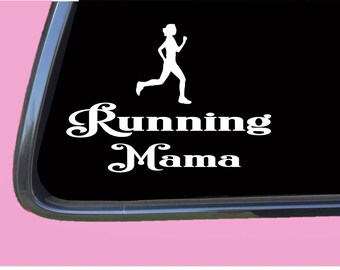 May include: White vinyl decal featuring a running figure above the words "Running Mama" in a decorative font. The decal is displayed on a black background, likely a car window, with a pink car body visible.