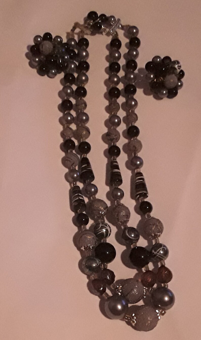Two strand necklace and cluster clip earrings made in Japan Mark Japan on the back of the earrings and on the necklace clasp