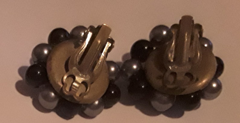 Two strand necklace and cluster clip earrings made in Japan Mark Japan on the back of the earrings and on the necklace clasp