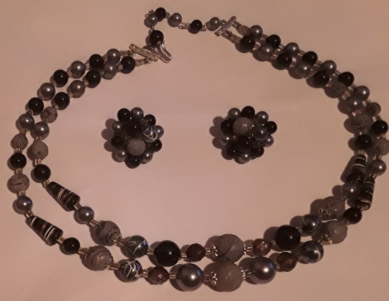 Two strand necklace and cluster clip earrings made in Japan Mark Japan on the back of the earrings and on the necklace clasp