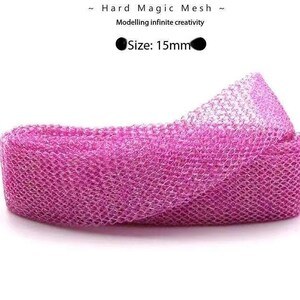 May include: Pink hard magic mesh, a flexible material used for crafting and modelling. The mesh is 15mm wide. "Hard Magic Mesh" and "Modelling infinite creativity" are printed on the white background.