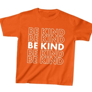 May include: Orange t-shirt with the text "BE KIND" repeated five times in white.