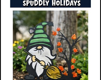 May include: A garden stake featuring a gnome with a green striped hat and white beard holding a yellow broom, positioned next to a black tree silhouette with orange autumn leaves. The text SPUDDLY HOLIDAYS is displayed above.