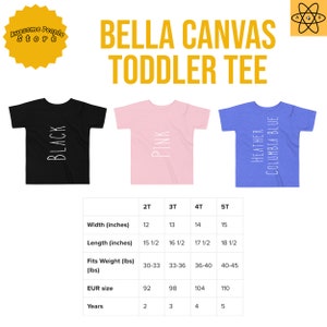 May include: A size chart for Bella Canvas toddler tees in black, pink, and heather Columbia blue. The chart shows sizes 2T through 5T with corresponding width, length, weight, EUR size, and age in years.