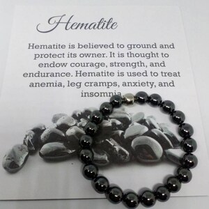May include: Hematite bracelet with black beads and a silver magnetic clasp. Hematite is believed to ground and protect its owner. It is thought to endow courage, strength, and endurance. Hematite is used to treat anemia, leg cramps, anxiety, and insomnia.