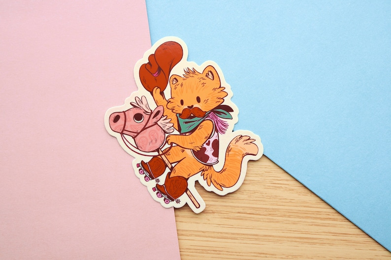 May include: A cartoon illustration of a cat wearing a cowboy hat and bandana riding a rocking horse on roller skates. The cat is orange and white, and the rocking horse is pink.