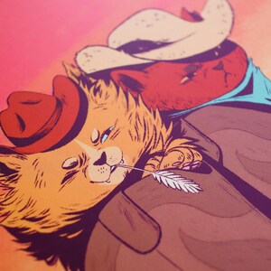 May include: Two cartoon cats wearing cowboy hats. The cat on the left is orange and has a feather in its mouth. The cat on the right is red and has a blue bandana around its neck.