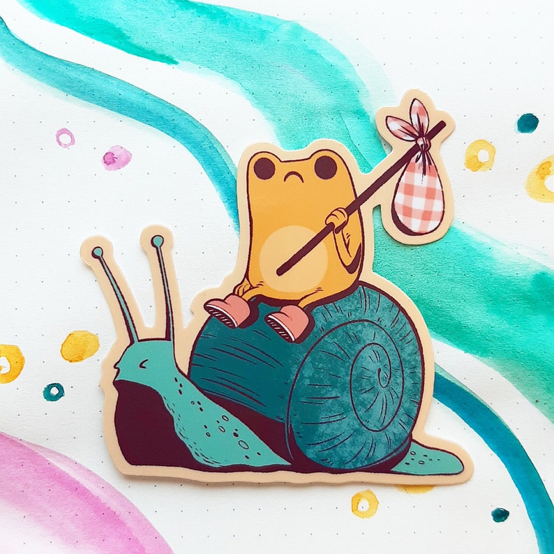 May include: A yellow frog with a red and white checkered bag sits on a green snail with a brown shell. The frog is holding a stick with a red and white checkered bag attached to the end.