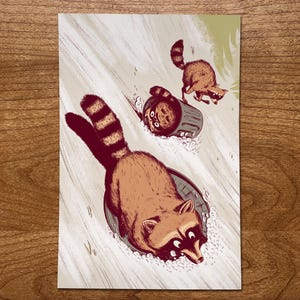 Raccoon Art Print, Winter Artwork, Raccoon Gifts, Funny Raccoon, Sledding Decor, Funny Animal Prints, Raccoon Illustration, Wildlife Art image 1