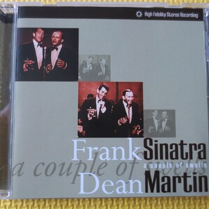 May include: A CD case with a gray background and a photo of Frank Sinatra and Dean Martin on the front. The text "Frank Sinatra" and "Dean Martin" are in large, bold letters. The text "a couple of swells" is in smaller letters below the names.