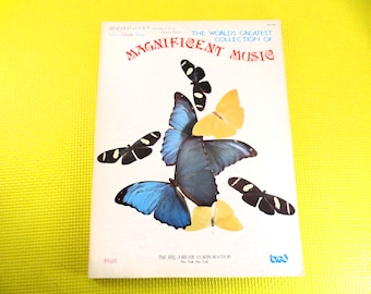 May include: A vintage music sheet titled "The World's Greatest Collection of Magnificent Music." The cover features illustrations of butterflies in shades of blue, yellow, and black against a white background. The text is in red and blue.